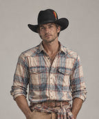 Male model wearing Viper dark neo-western cowboy hat in premium black felt with a leather jacket LBORA