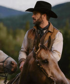 Detailed crown shape and white accent plume on the black Magnate hat
