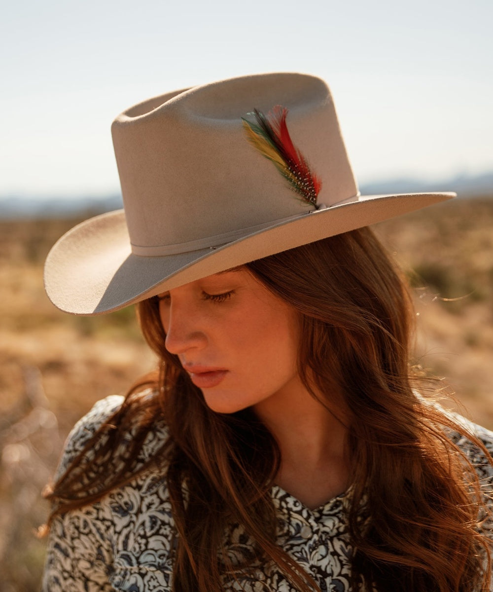 Female model wearing Latitude felt cowboy hat in natural cream color for a sharp western look LBORA