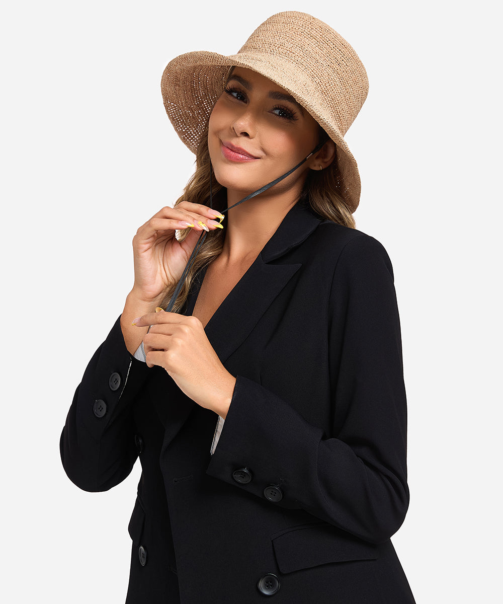 Premium Solstice black woven straw bucket hat designed for easy packing and beach resort vacations