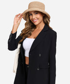 Rear view of a female model highlighting the textured weave of the Solstice natural straw bucket travel hat